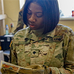 soldier reads sheet
