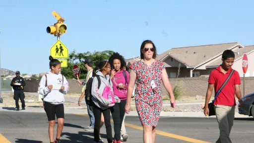 Students walk through crosswalk