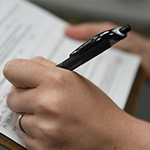 Taking notes on a clipboard