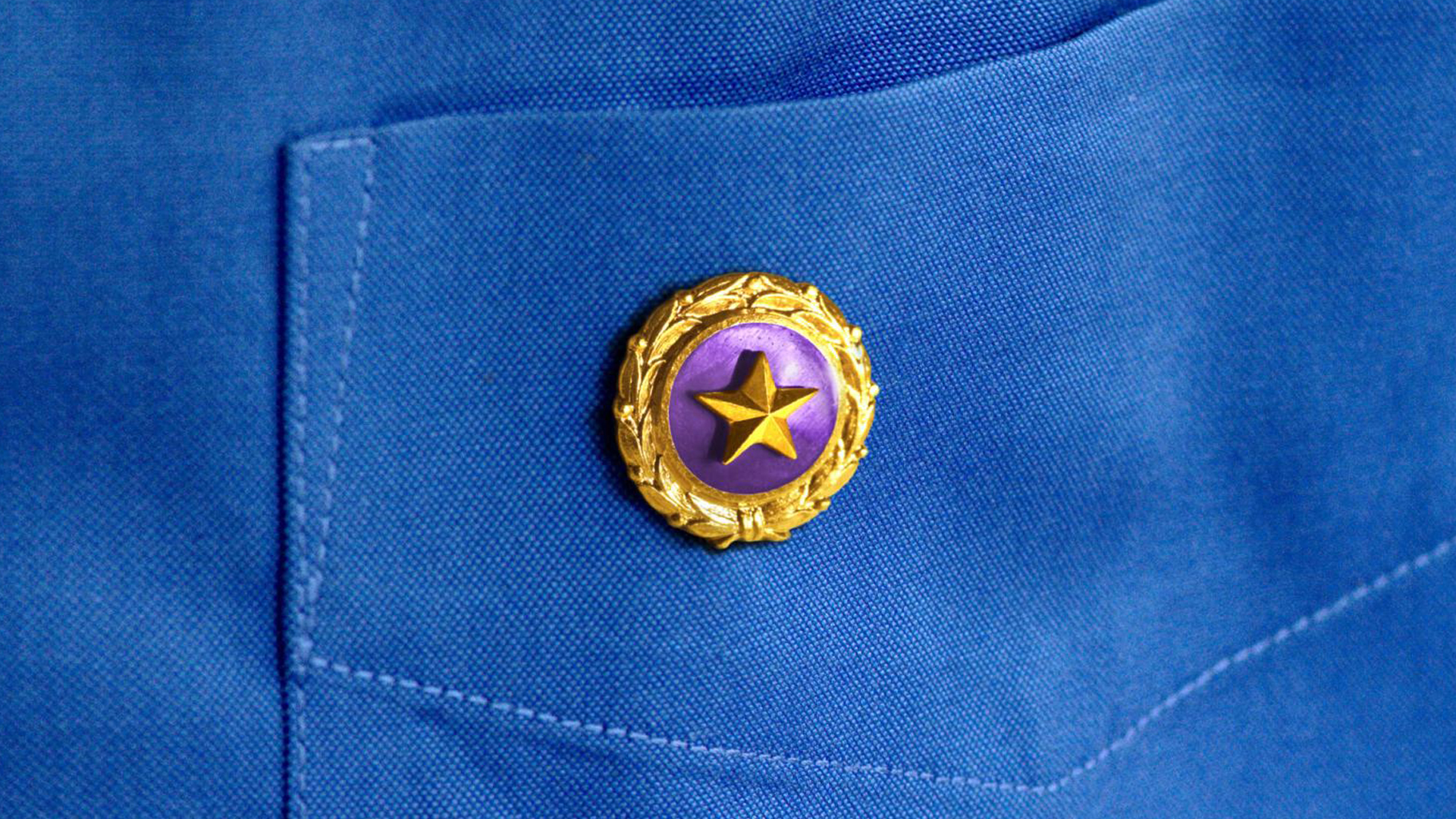 Gold Star on blue shirt