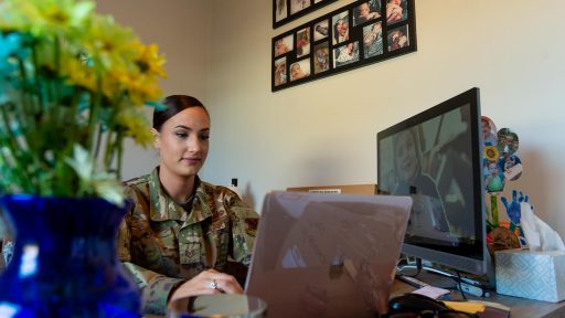Military mom working on laptop