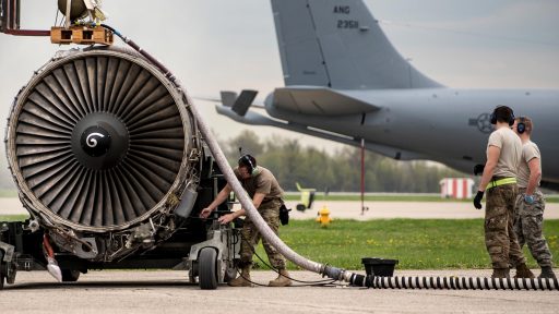 Airmen prepare an engine for shipment.