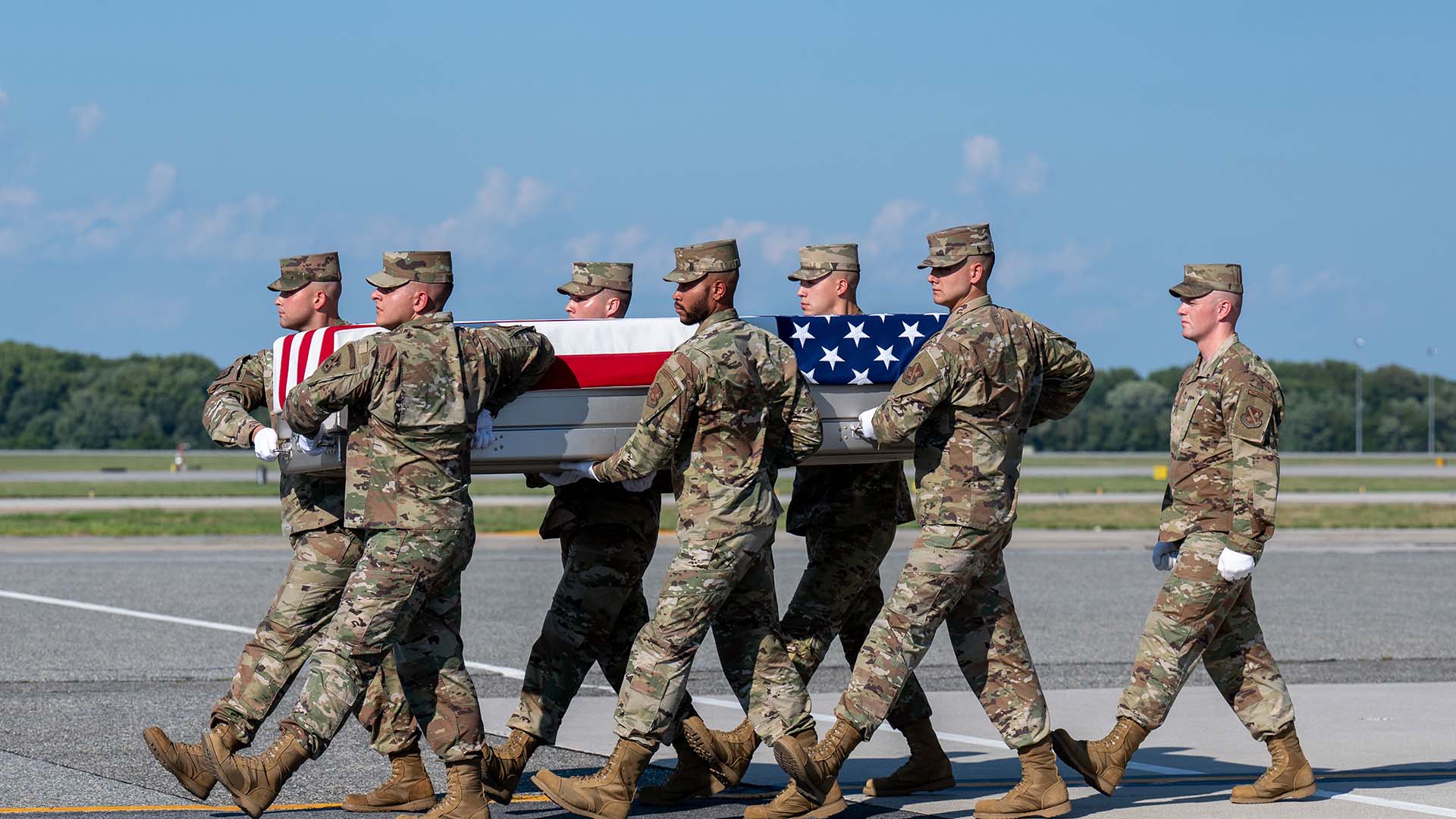 mortuary affairs workers transferring remains