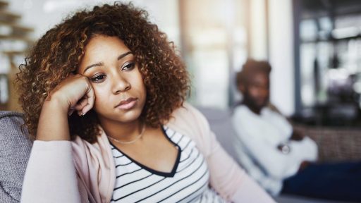 disconnected couple on couch