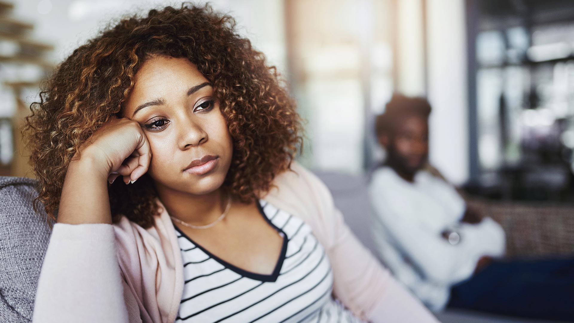 disconnected couple on couch