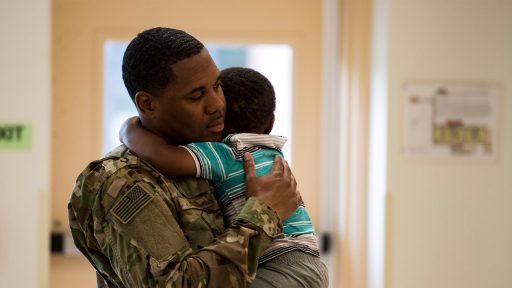 A father holds his son