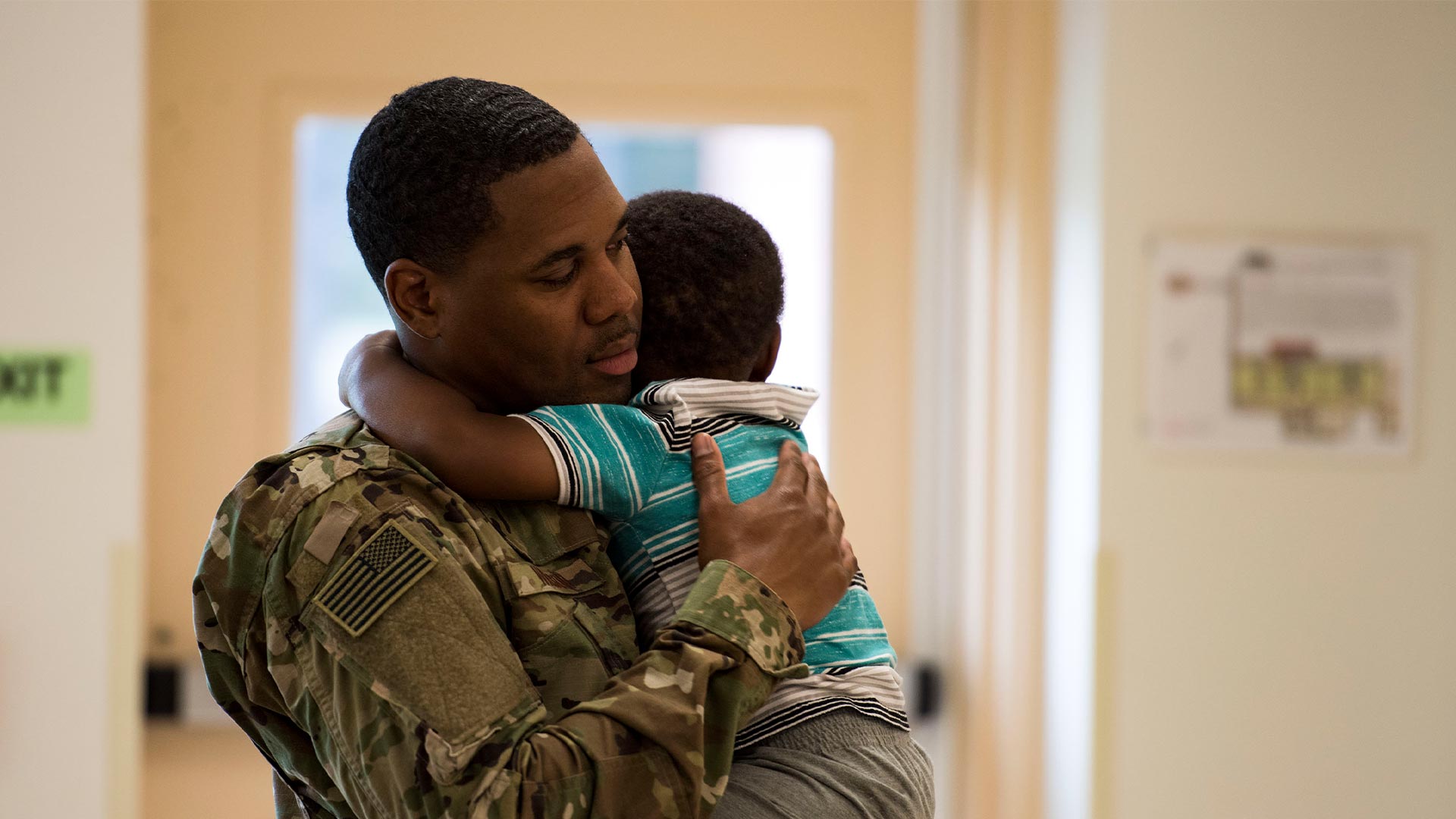 A father holds his son