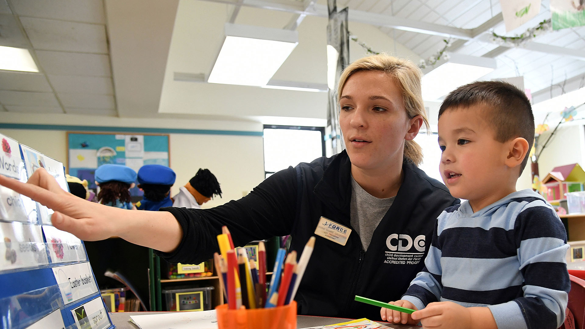 Staff with child in a development center
