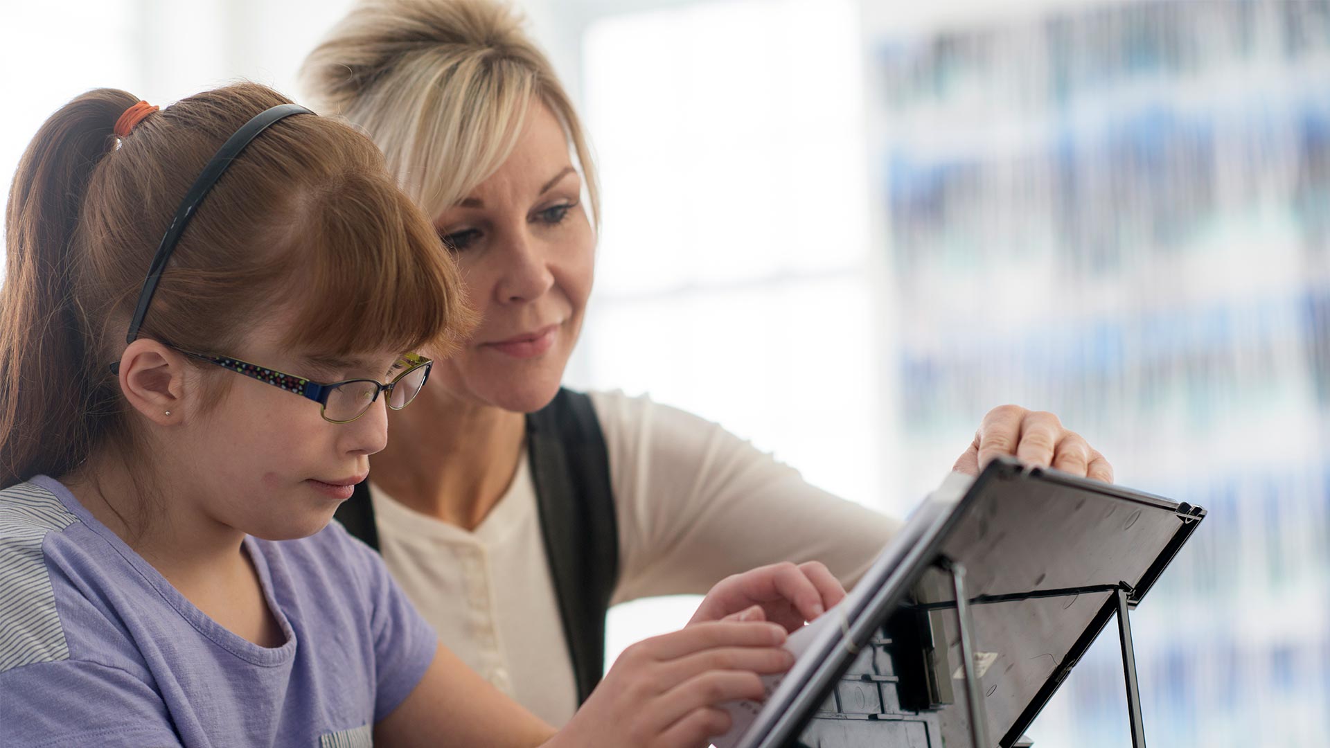 Elementary age girl using a digital tablet