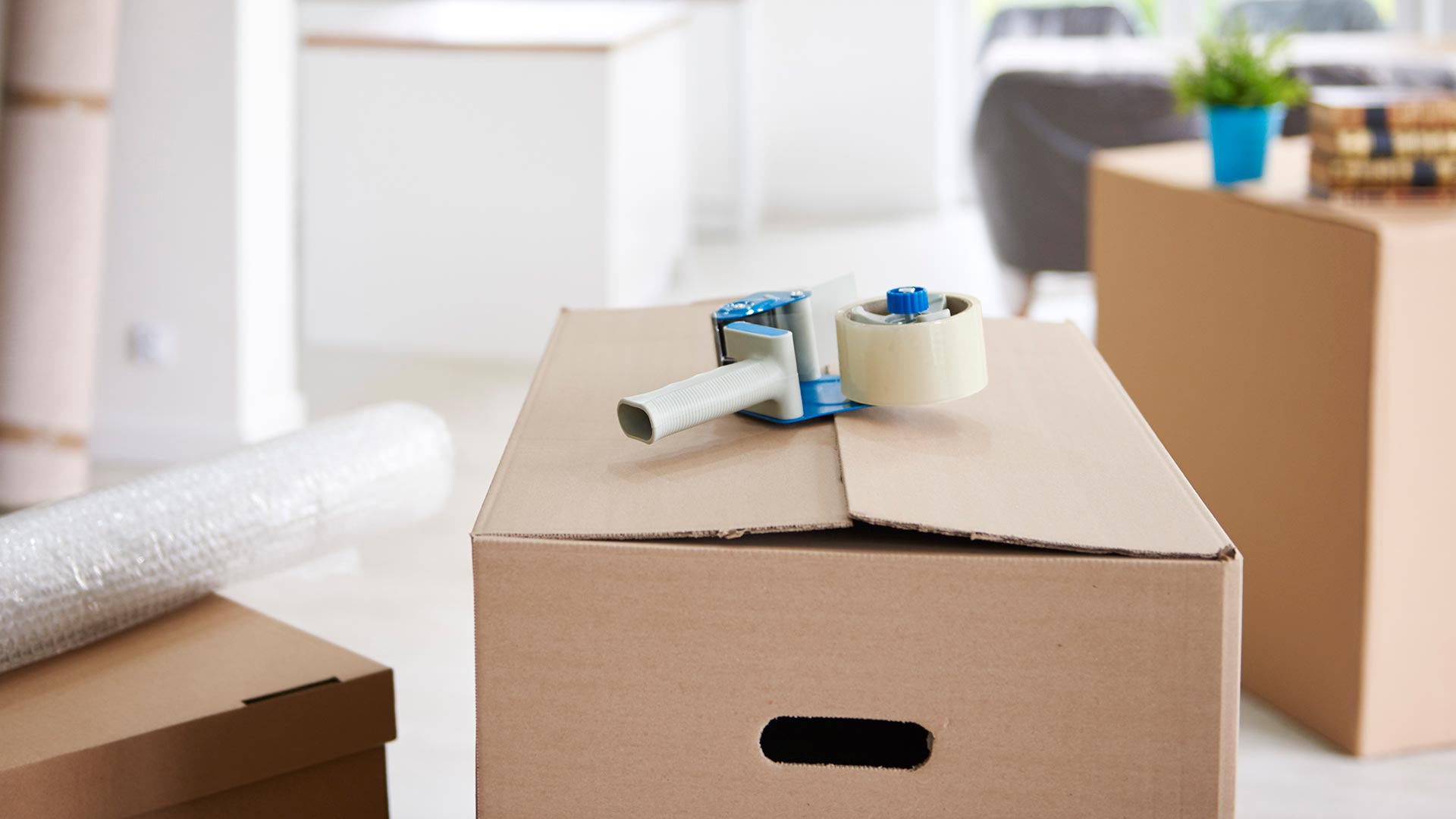 Packed moving box with tape and bubble wrap