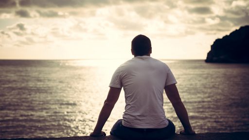 man looking at water