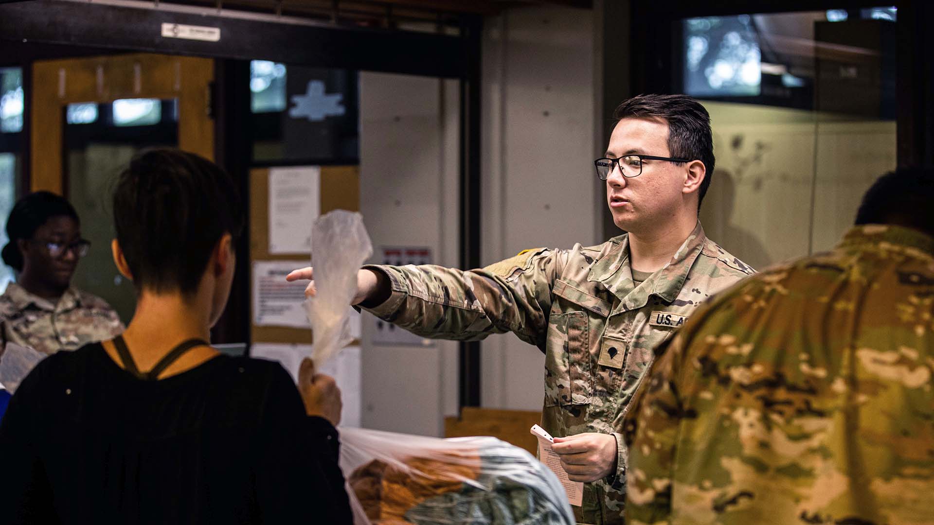 service member helps coordinate at assistance center