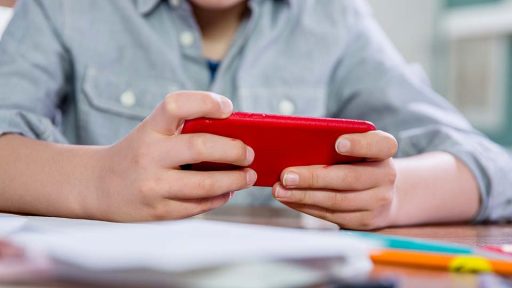 A child holds a cellphone