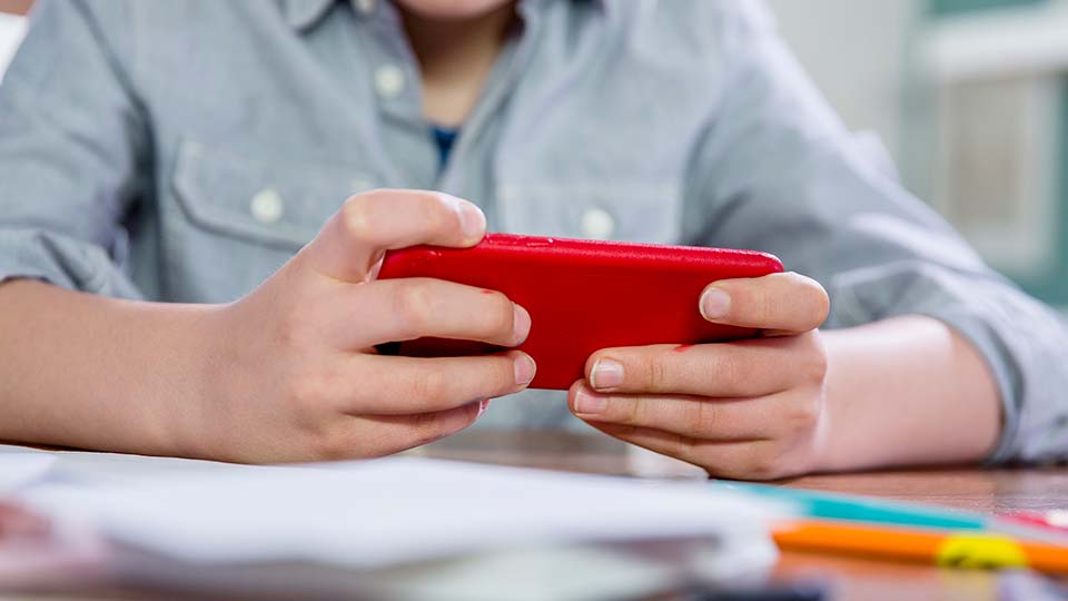 A child holds a cellphone