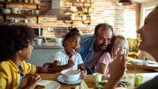 Mixed family at dinner table