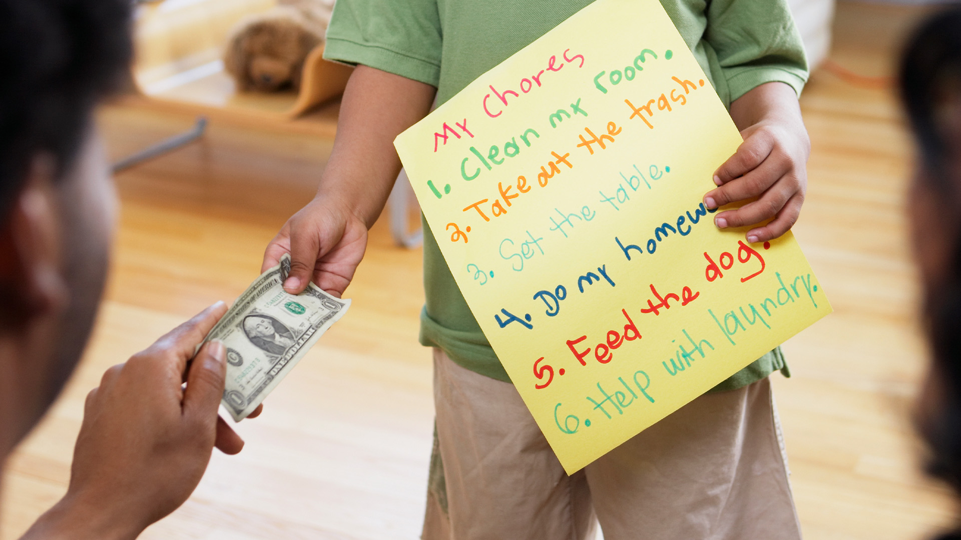 Father gives child money for chores