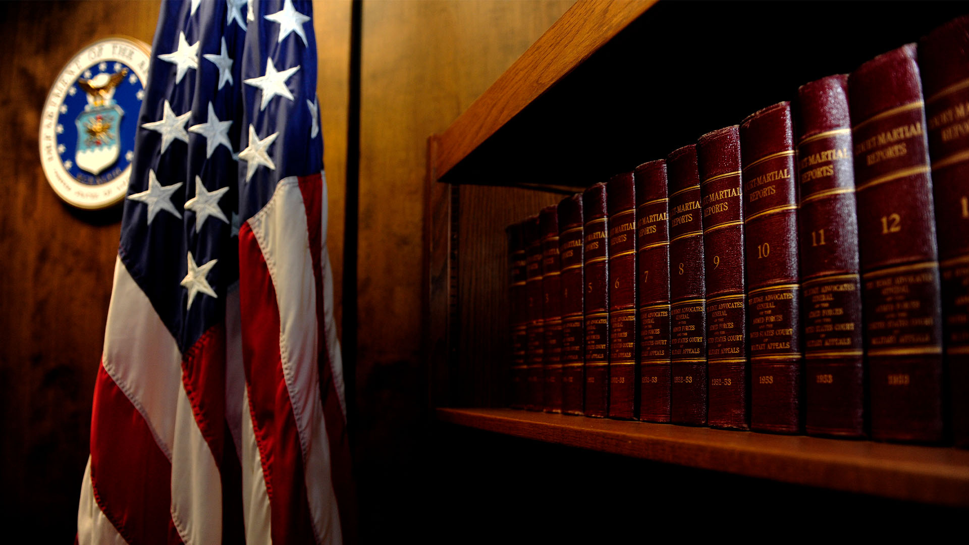 American flag next to bookshelf