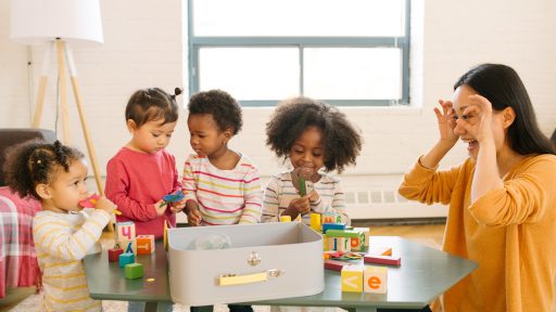 Child care worker with children in home