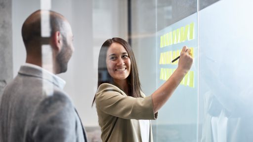 woman in office talking to coworker