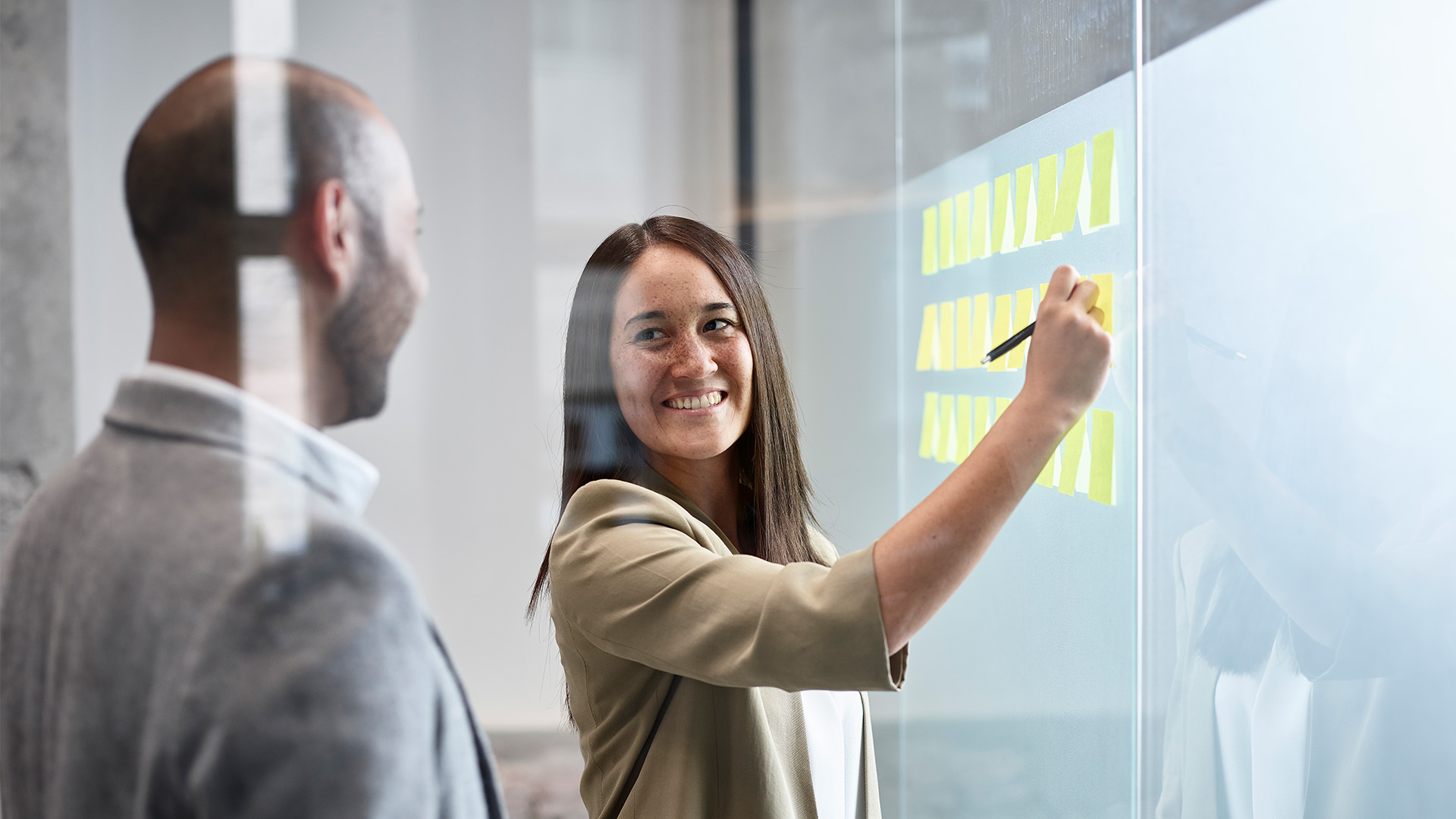 woman in office talking to coworker