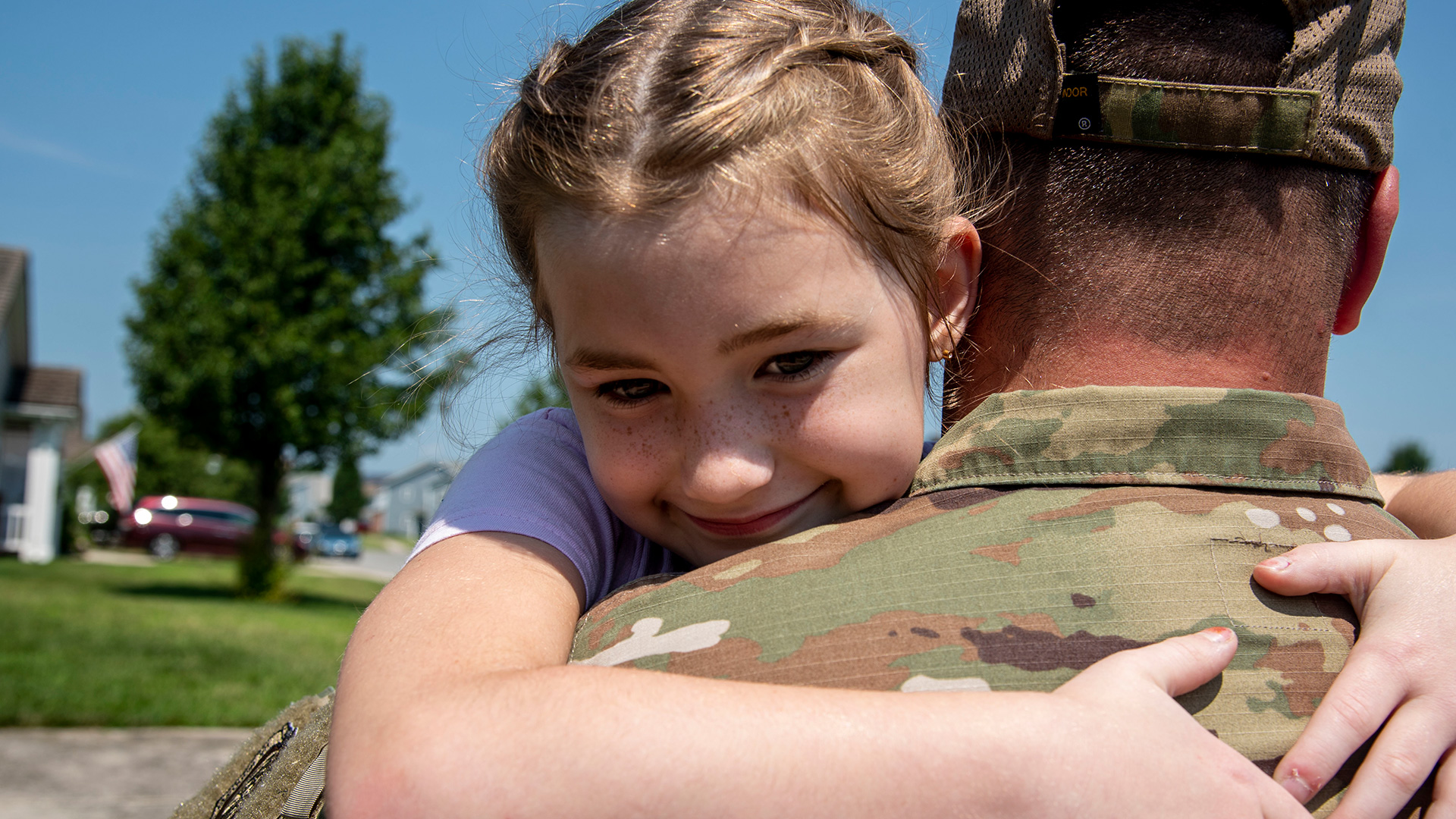 Young child hugging father