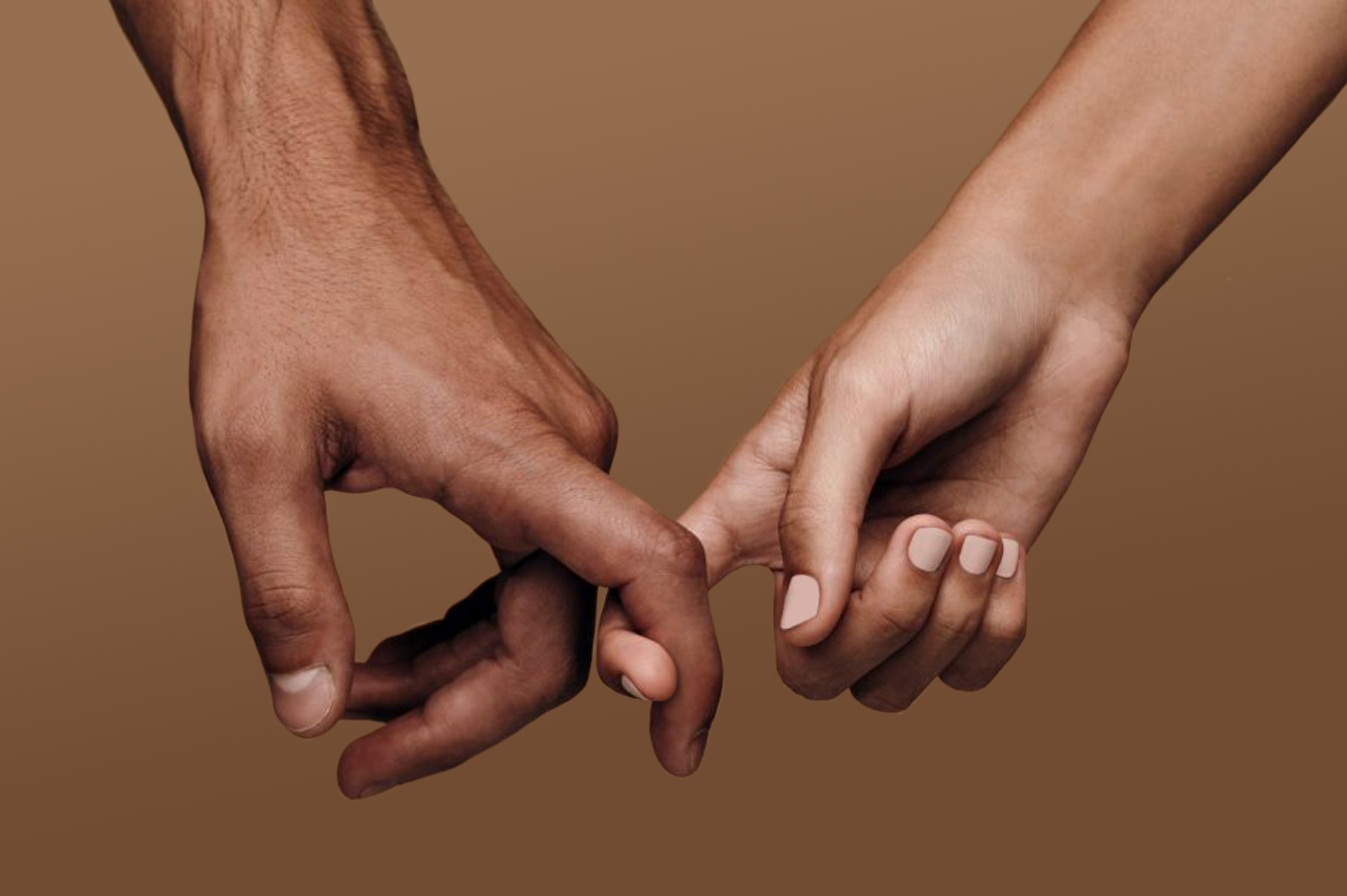 Two hands with interlocking index fingers