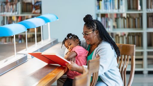 Mother reads to daughter