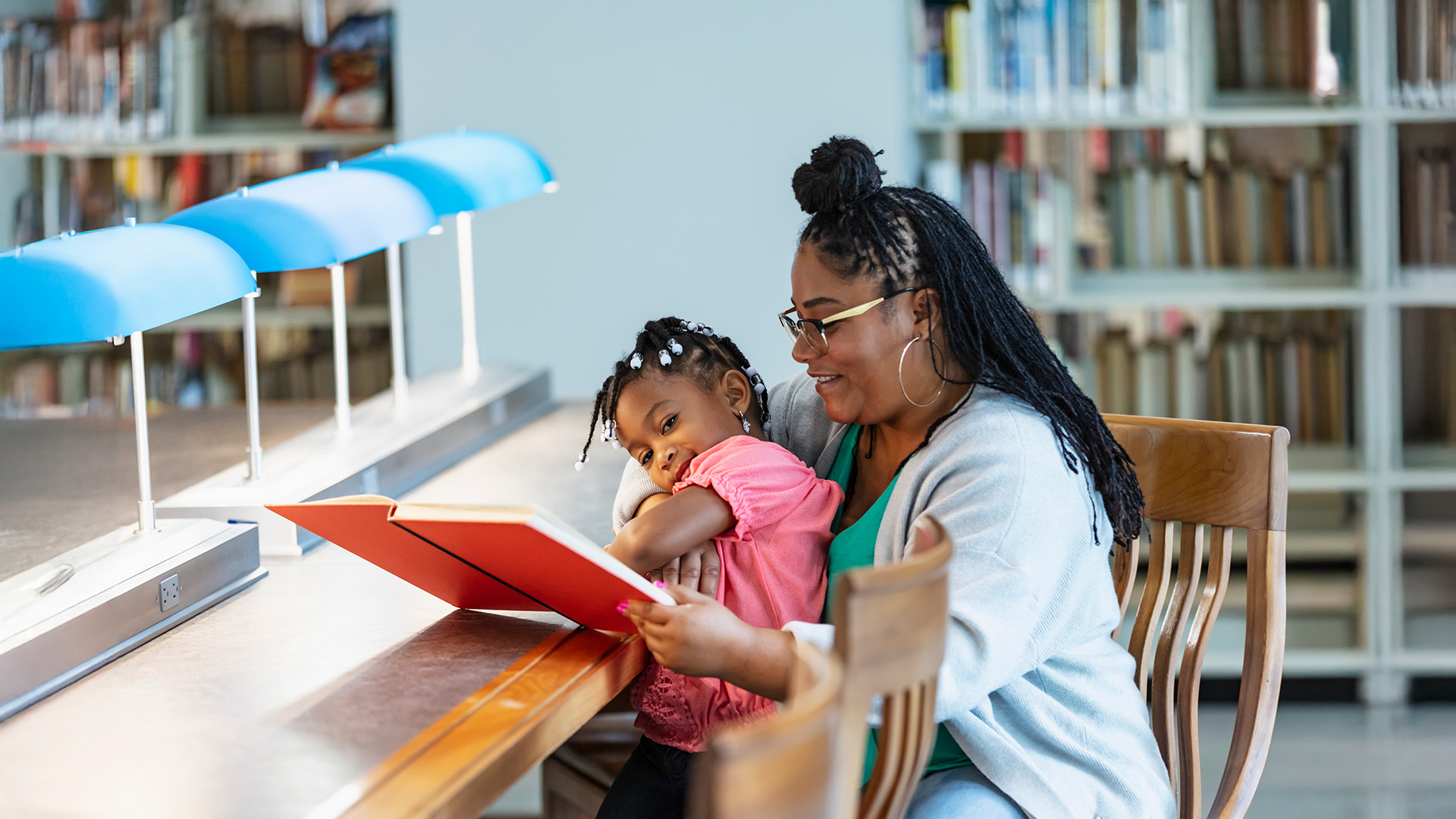 Mother reads to daughter