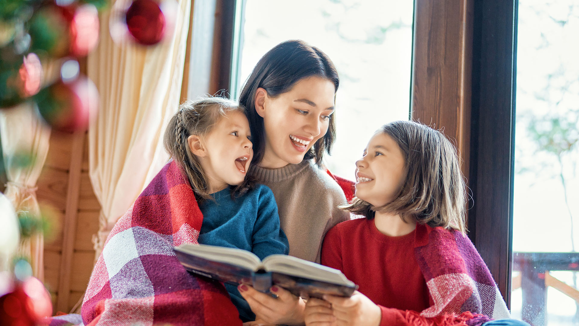 mother and children reading together
