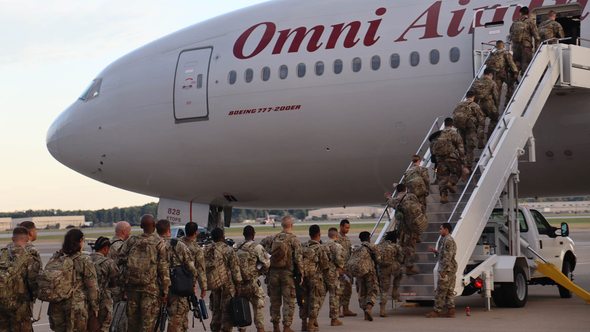 Soldiers boarding plane for deployment