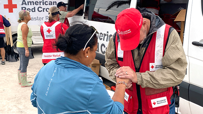 red cross volunteer providing hurricane assistance