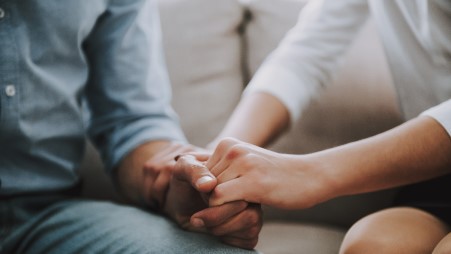 two people holding hands