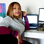 woman uses home computer