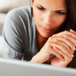 Concerned female using laptop