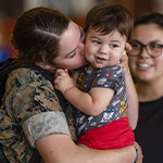 marine-mother-kisses-child