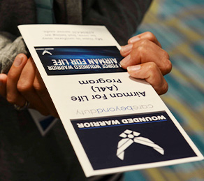 person holds resource pamphlet