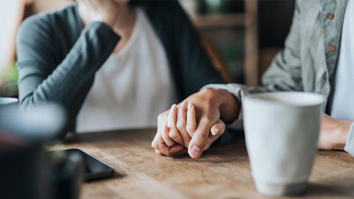 two people holding hands