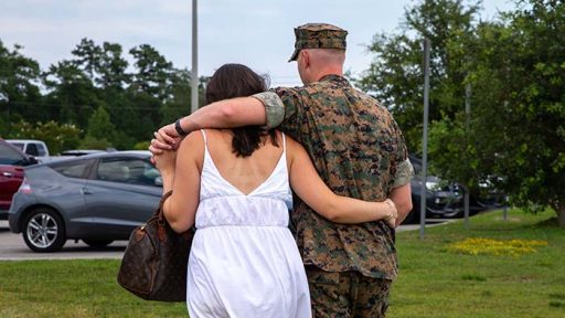 service member and spouse arm-in-arm