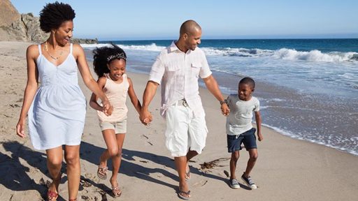 family walking on beach