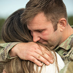 father hugs daughter