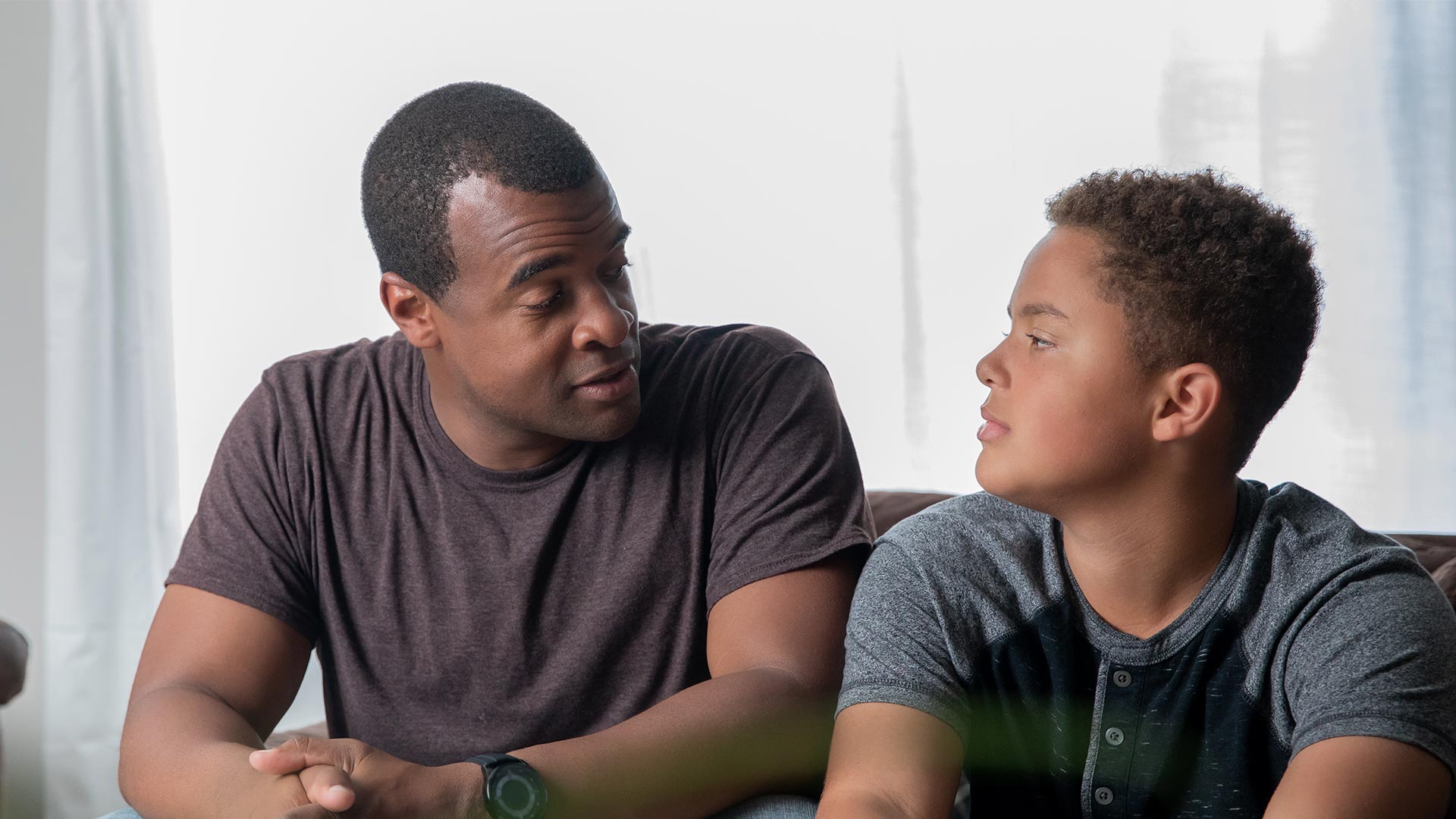 father talking to son