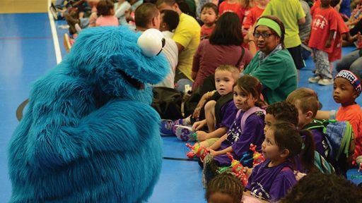 Cookie Monster engages with children