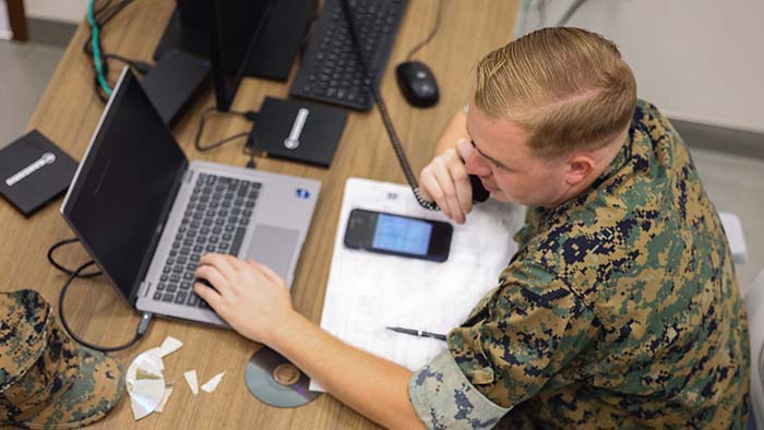 service member working at desk
