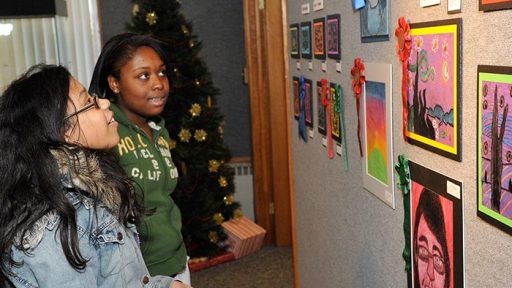 teens looking at artwork