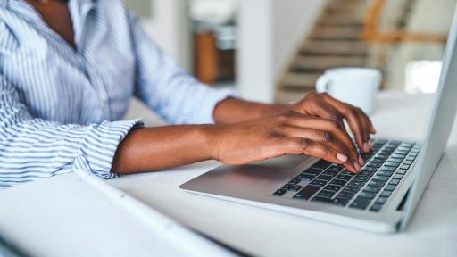 person using laptop from home