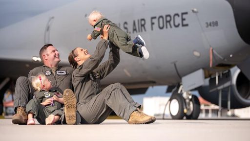 military family infront of airplane