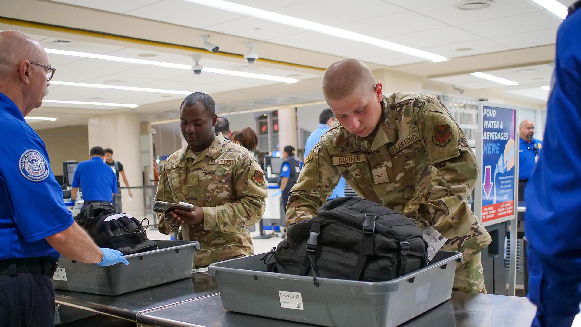 Service members going through TSA
