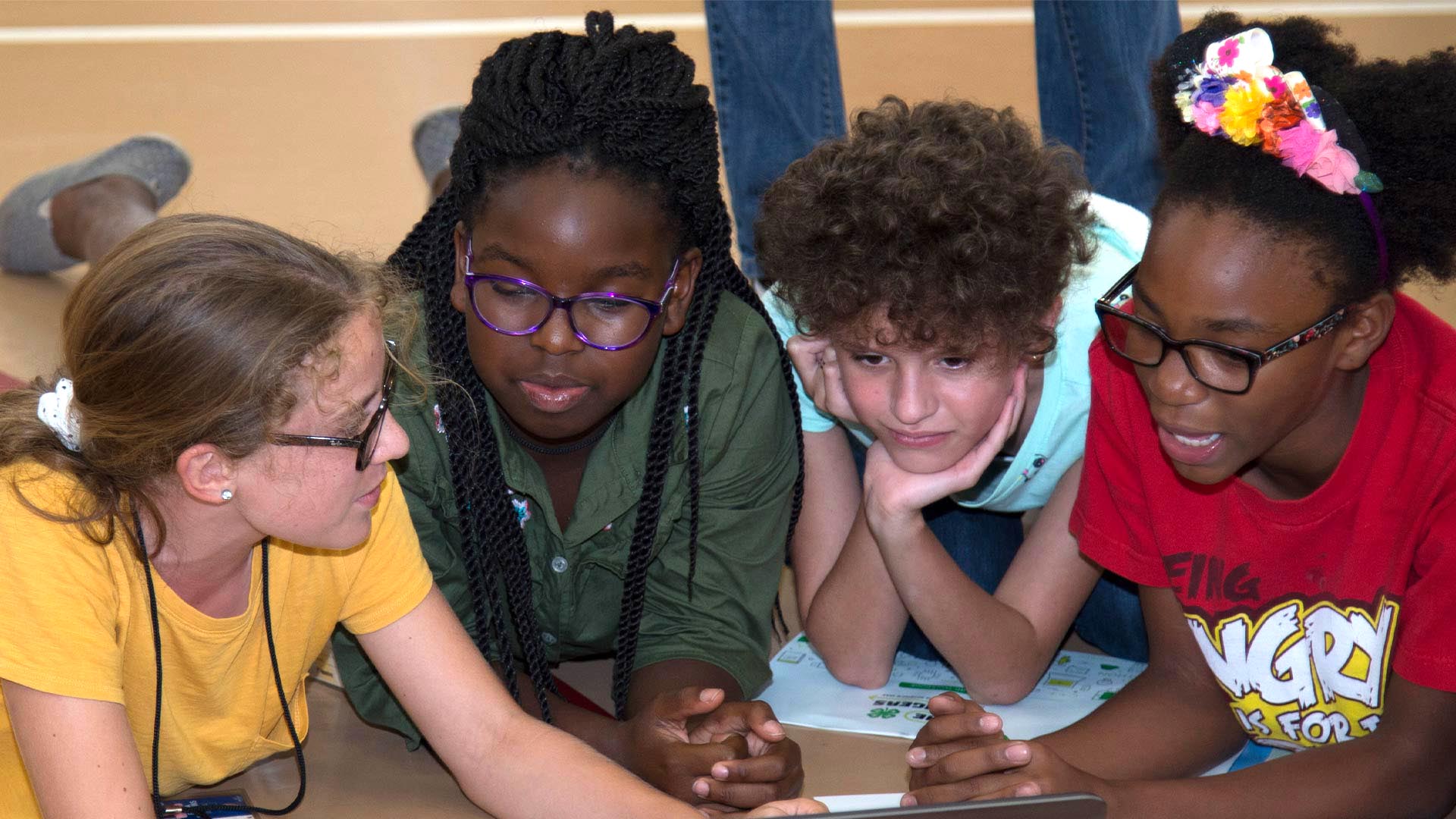 Students gathered around computer