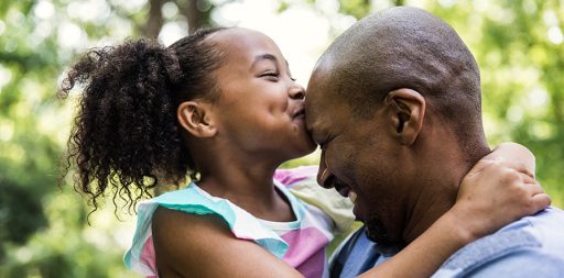 father and daughter in yard