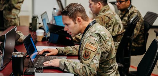 service member working on computer